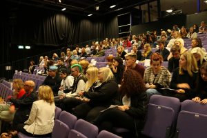 A lecture theatre full of young people