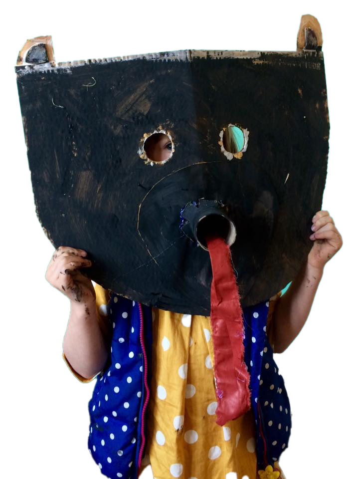 Child holding hand-made animal mask over their face
