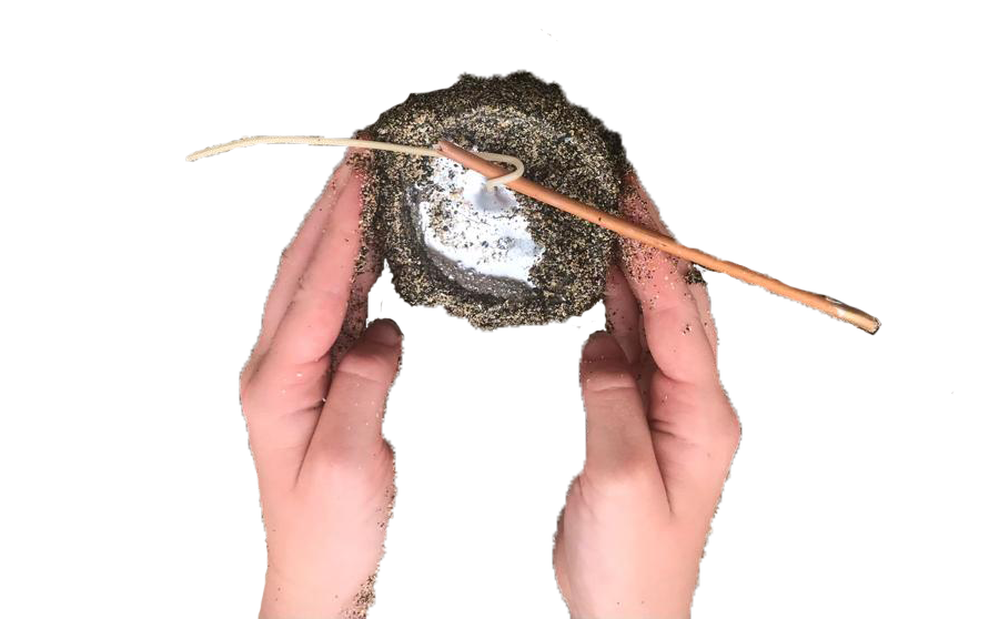 Hands holding a hand-made candle