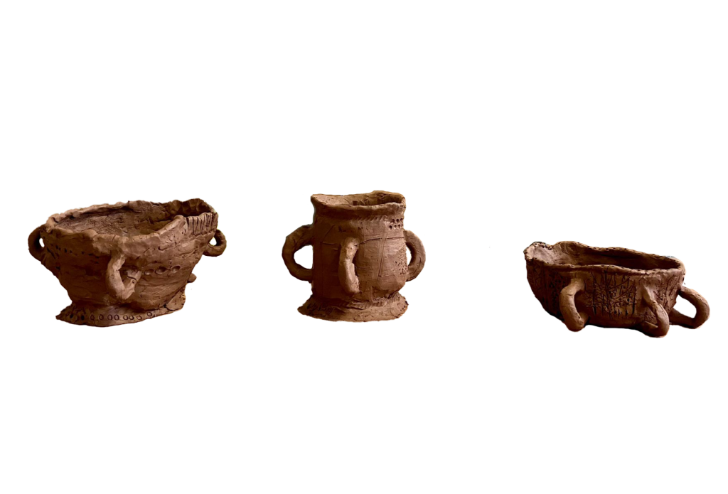 Three large hand-made clay pots