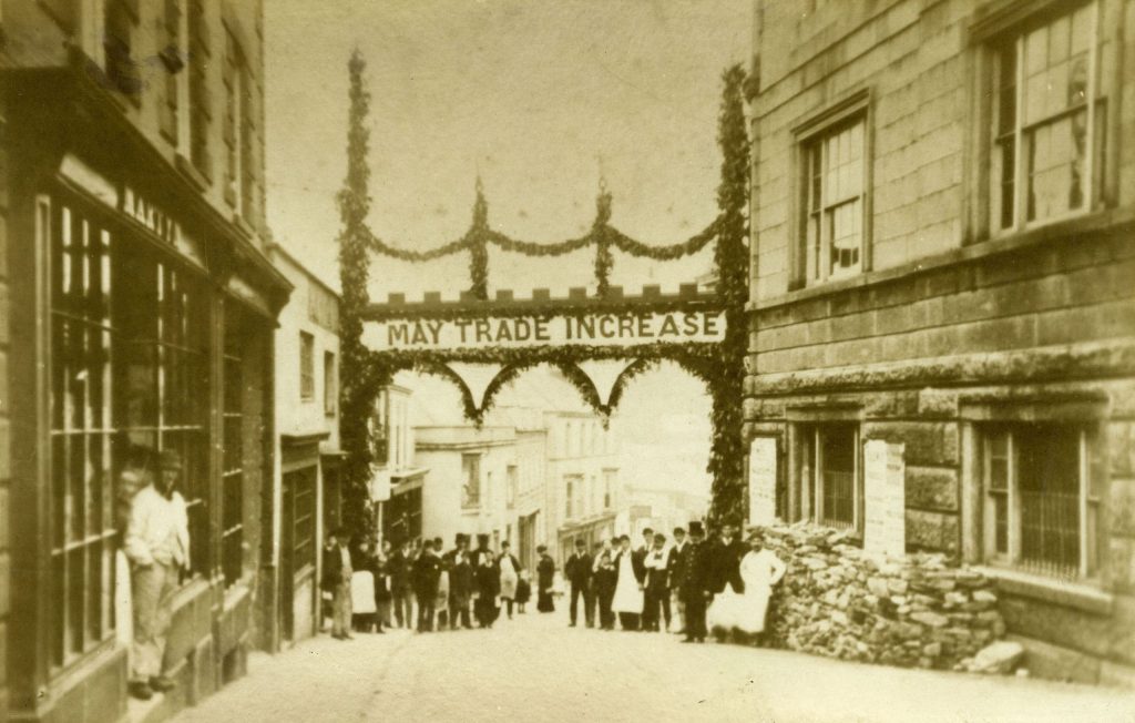 Archway erected in Helston to celebrate the start of construction of the railway to Helston, 22 March, 1882. The archway is in Church Street with the words 